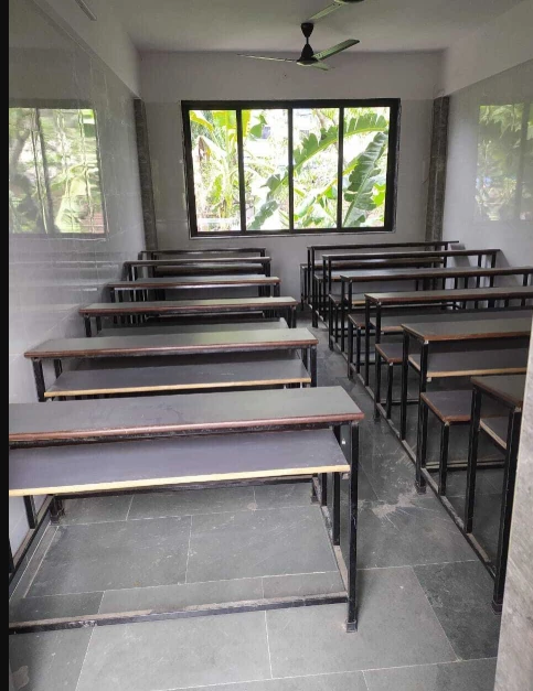 Study benches in a classroom with a window